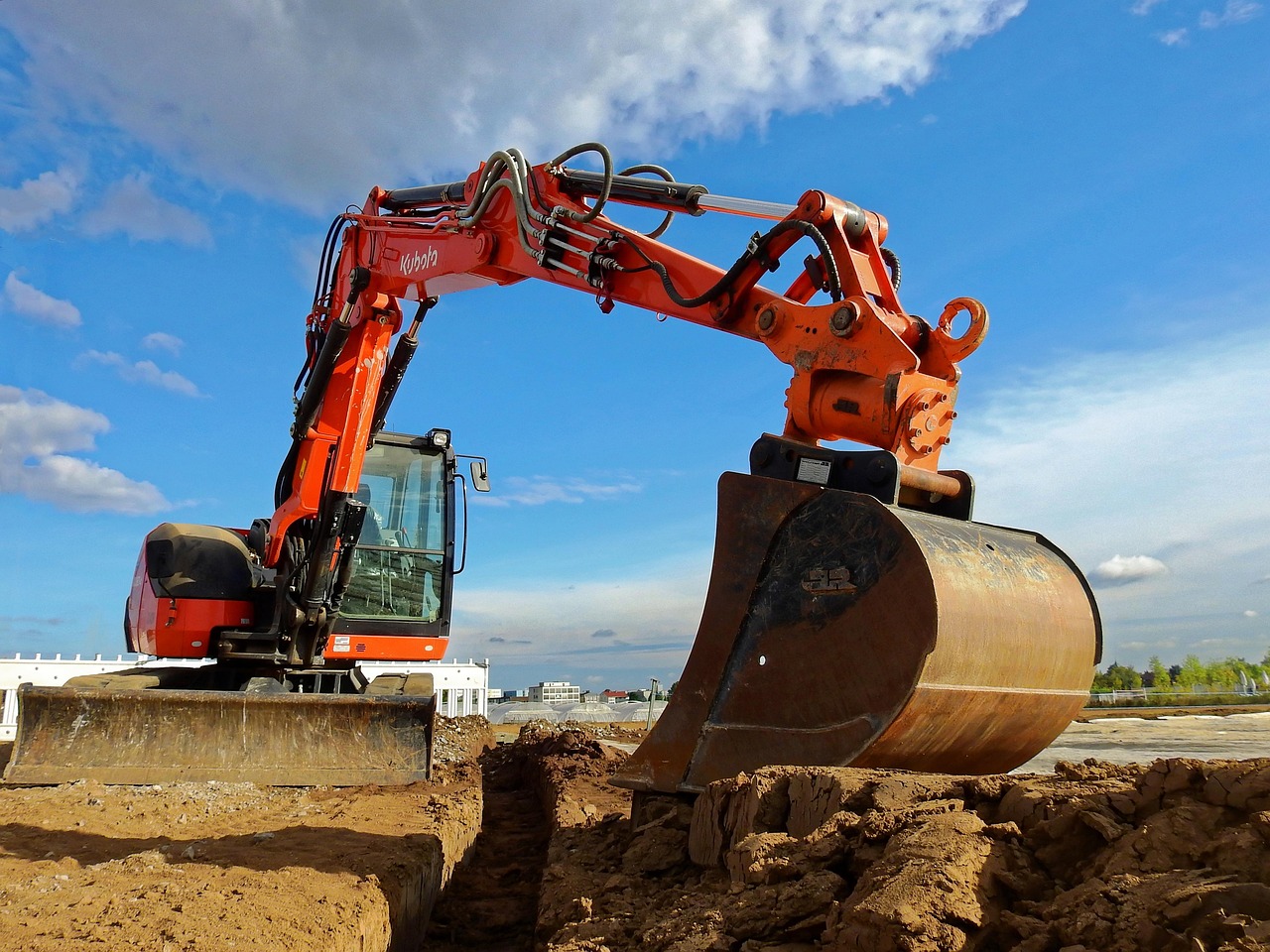 Excavation company in North Texas using heavy equipment for trenching and site preparation on a construction site