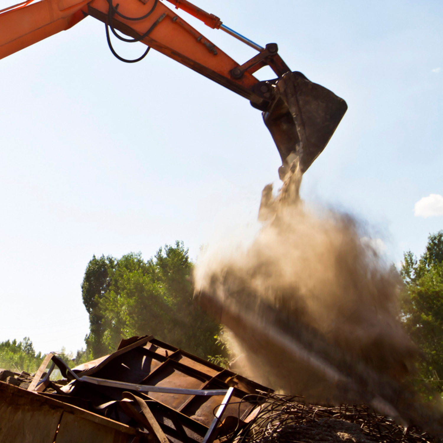 "Excavator clearing demolition debris and dust from a job site – Outta Bounds Excavation providing safe and efficient structure removal services in Northeast Texas.