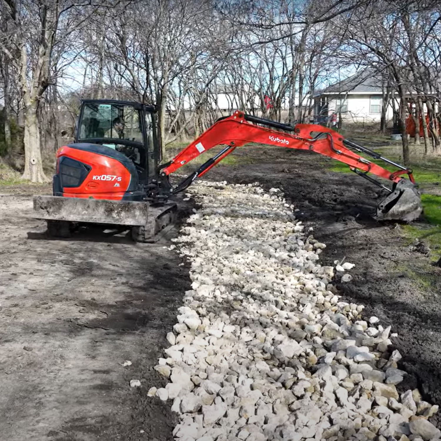 Flattening gravel over Drainage Ditch Construction in Northeast Texas